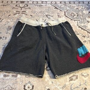 Nike Charcoal Shorts with Red and Blue Swoosh in raised fabric size M